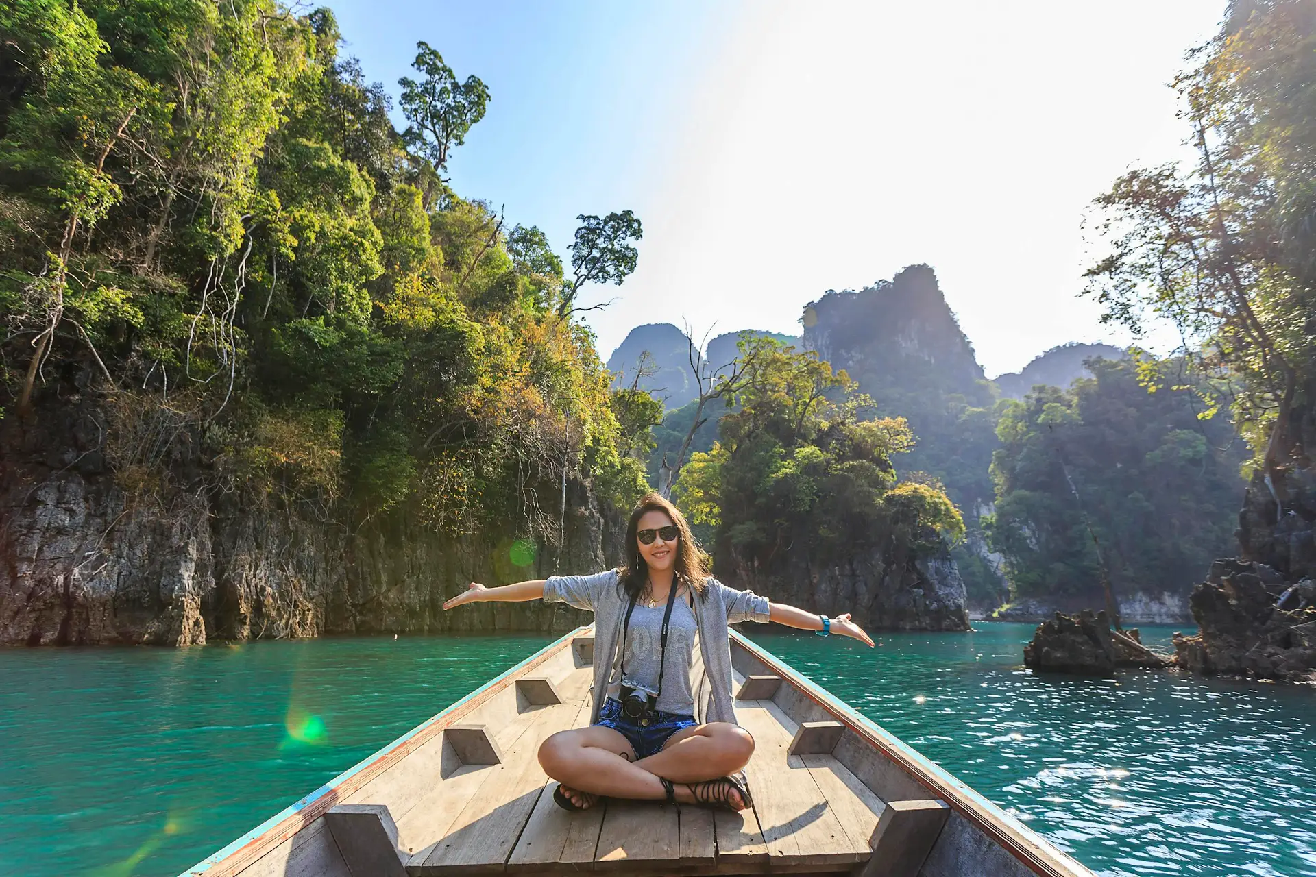 Serene boat journey through the lush karst landscape of Thailand's Khlong Sok.